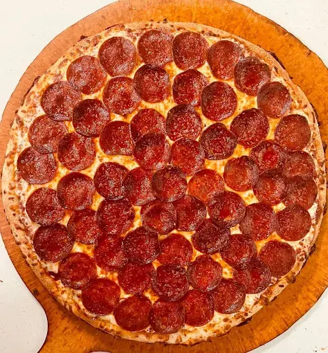 Butter Chicken Pizza at Pizza 64 - Country Hills Calgary